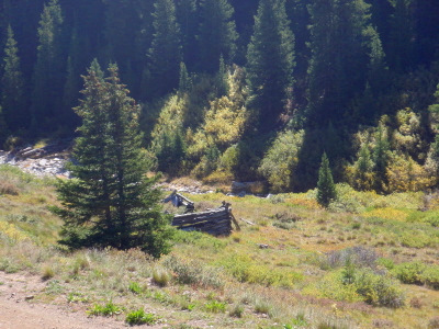 The view is of an old mining lodge on Wightman Fork of the Alamosa River.